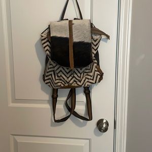 myra black and white cow printed bag